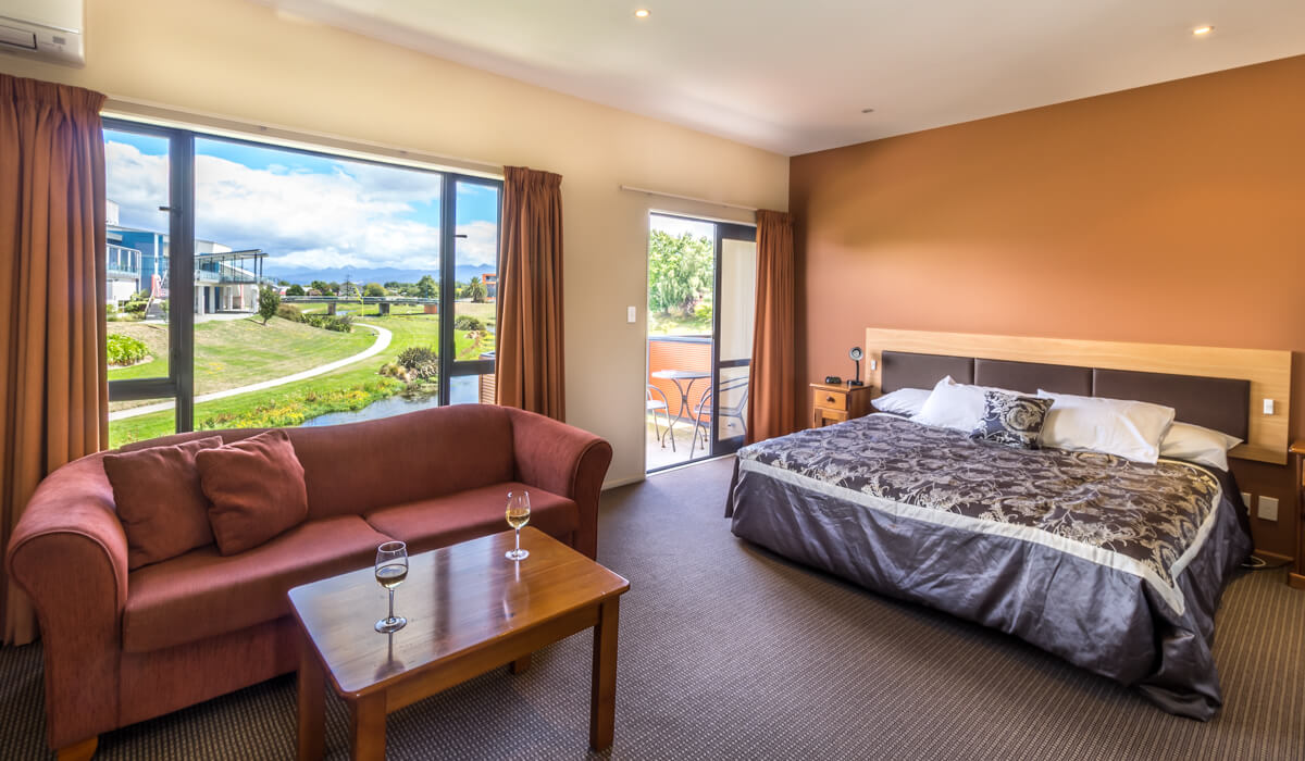 Lounge Bed And Balcony In Spa Studio At Waterfront Motels