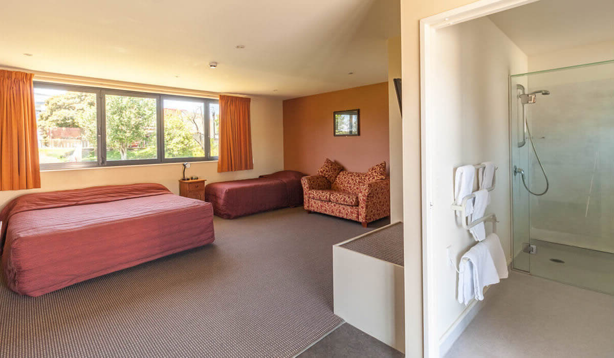 Bathroom And Living Area In Accessible Studio At Waterfront Motels In Blenheim
